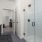 Bathroom with glass shower with vanity and large mirror