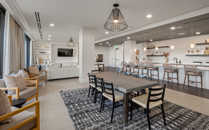 a large living room with a large glass wall