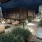 a patio with a pool and chairs